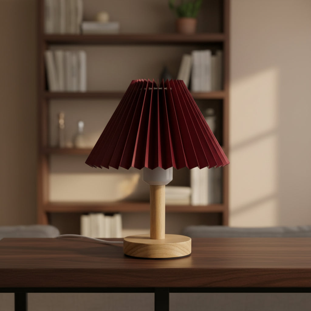 Pleated conical table lamp with red pleated shade and light wood round base