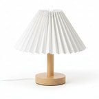 Pleated conical table lamp with white pleated shade and light wood round base