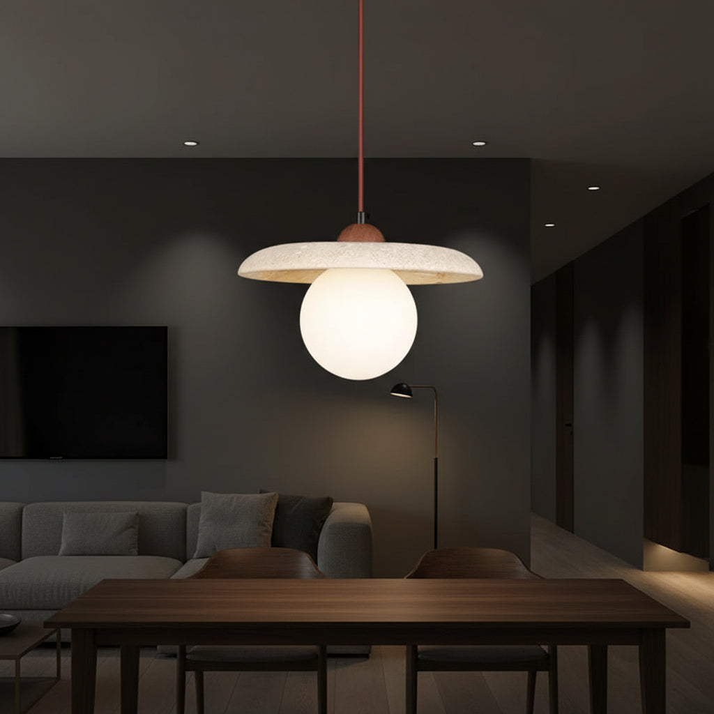 Globe pendant light with round off-white glass globe under travertine disc canopy