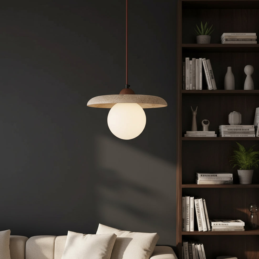 Single globe pendant light with speckled travertine shade and round off-white bulb