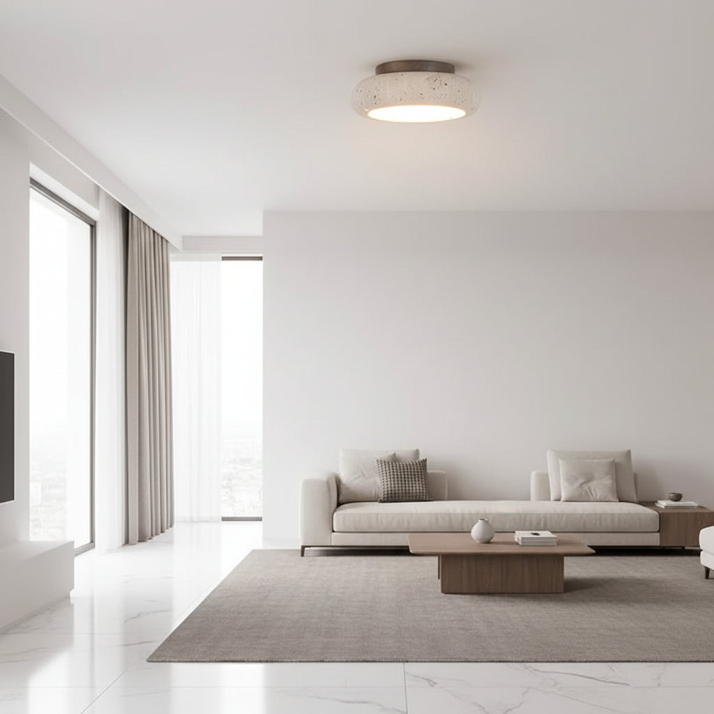 Round ceiling flush mount light with speckled travertine shade and warm glow
