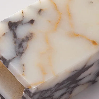 Marble panel texture of a rectangular wall light sconce with warm backlight