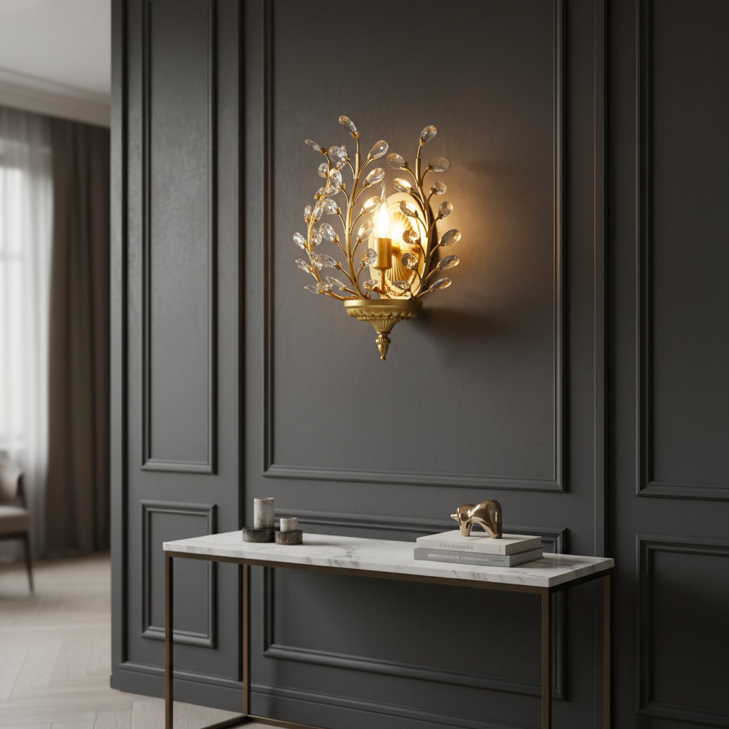Botanical crystal branch wall sconce in gold with glowing bulb and clear faceted drops