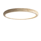 Round travertine-look ceiling flush mount light with thin circular rim and warm glow