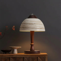 Minimalist ceramic dome table lamp with striped shade, dark wood stem, round base